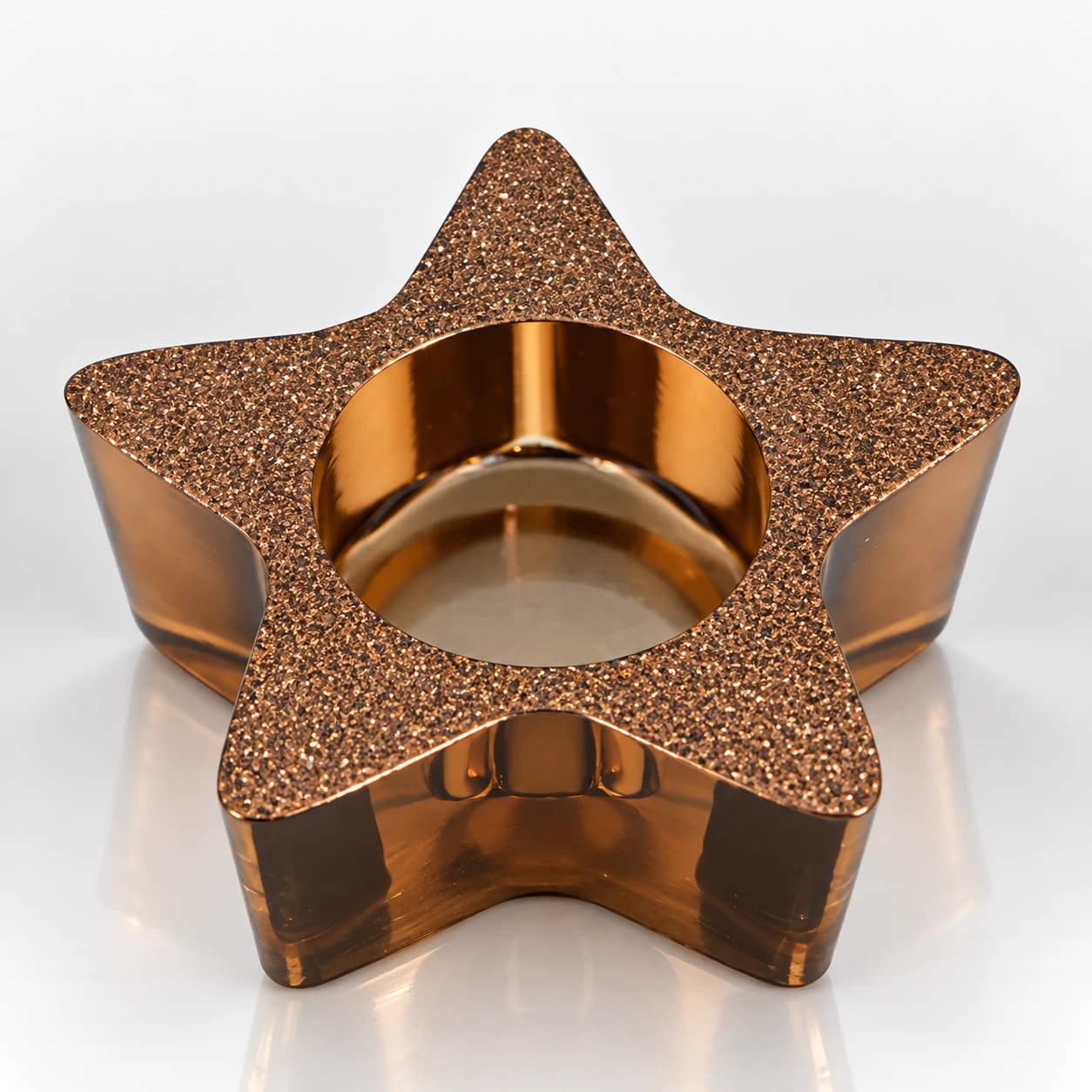 Star-shaped metallic candle holder with a sparkling bronze-gold textured finish.