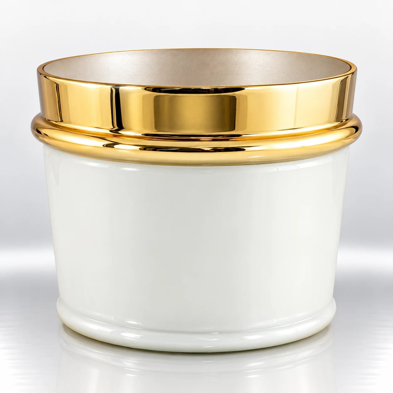 Ivory white cylindrical glass candle holder with a polished gold-tone upper rim and rounded decorative base band.