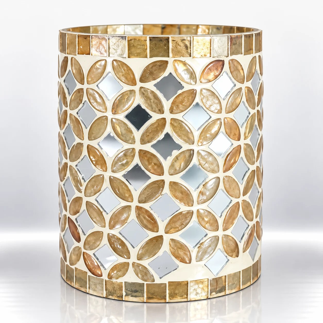 Cylindrical gold mosaic glass candle holder with leaf-shaped decorative pieces, silver mirror accents and gold-toned borders.