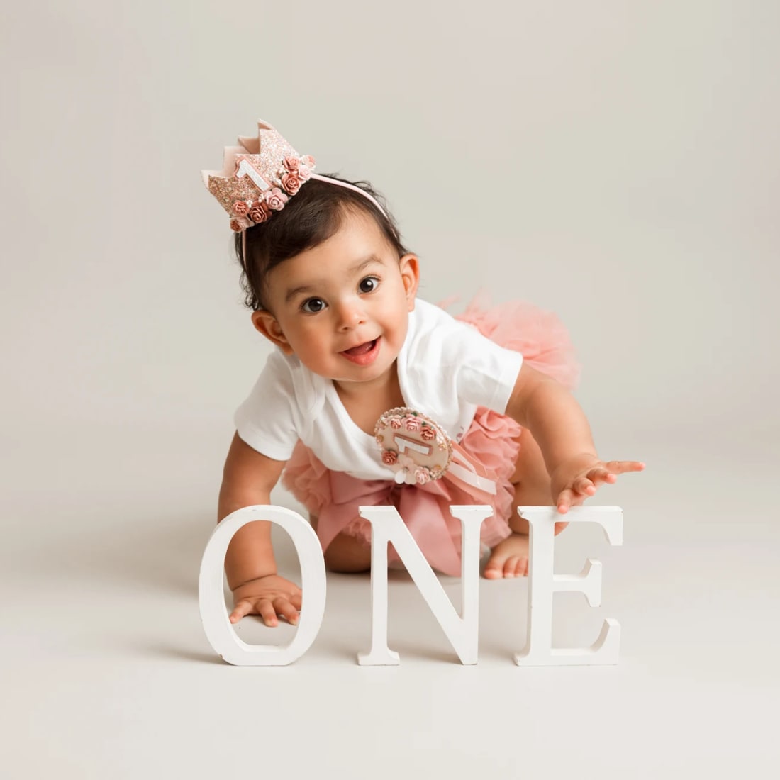Baby crawling towards the letter one for 12th month old photo