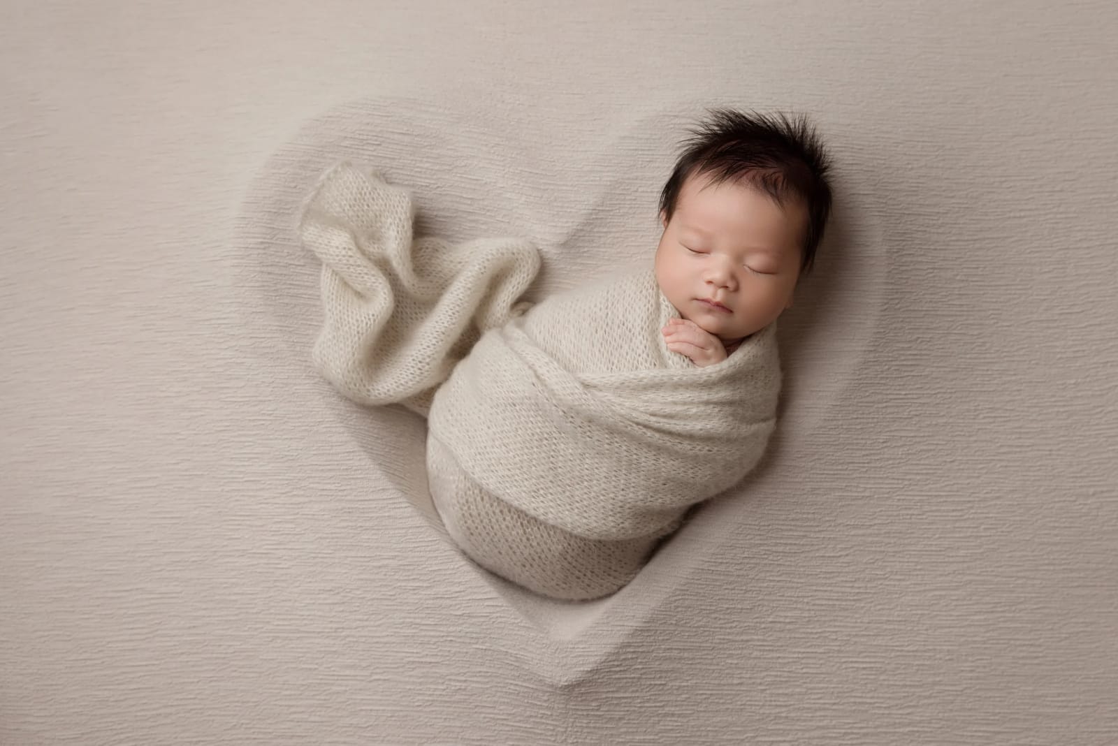 Newborn Baby in Heart Shaped Bowl