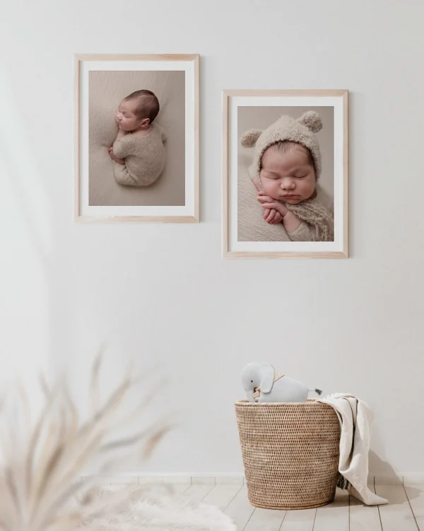 Two framed baby portraits on a wall, creating cherished heirlooms for families in South Lanarkshire