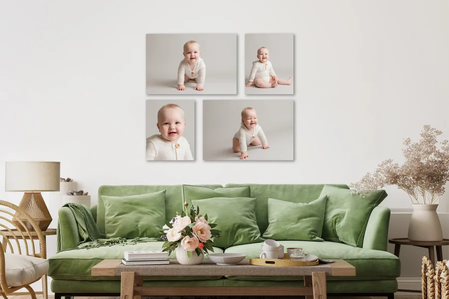 A living room features a collage of adorable baby photos by Louise Mallan Photography, styled with a green sofa and floral decor