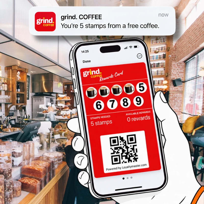 Hand holding a phone in a cafe showing a grind. COFFEE digital stamp card, with a push notification saying you are 5 stamps from a free coffee