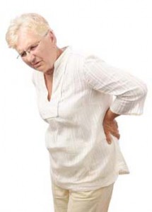 Elderly woman holding back in pain