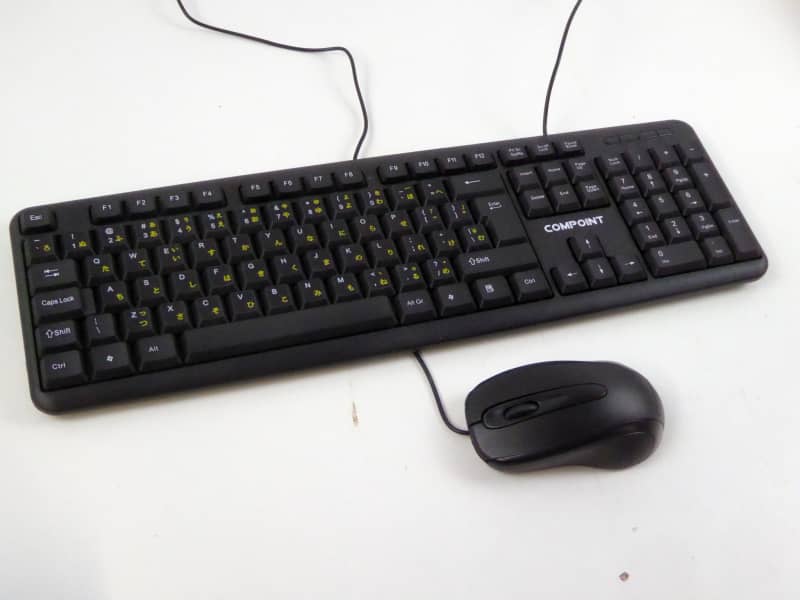 Modern black PC keyboards with matching black mice