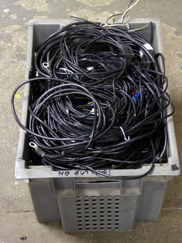 Crate of plain black cables