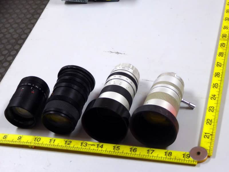 Selection of medium sized technical looking camera lenses.