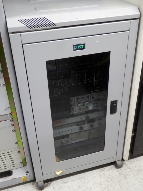 Low, wheeled server rack in light grey with smoked glass removable door