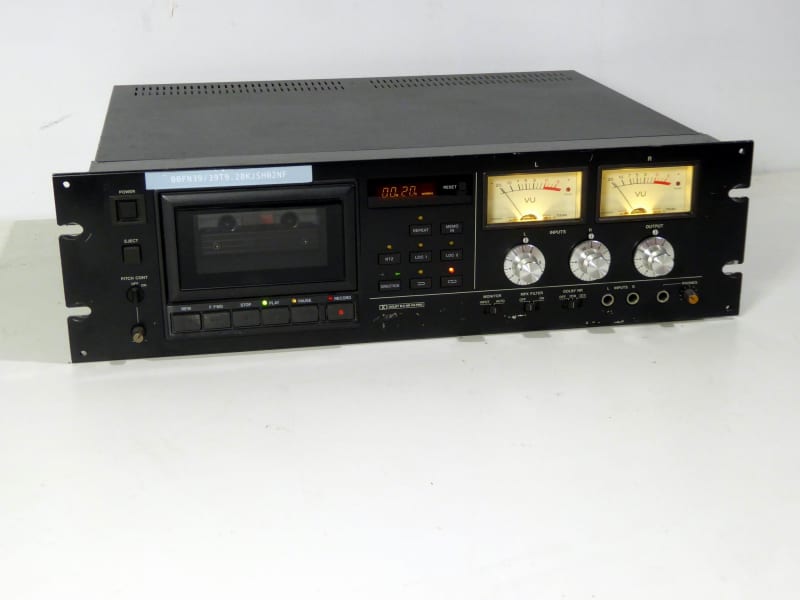 Practical black rack mount cassette tape deck, illuminated VU meters