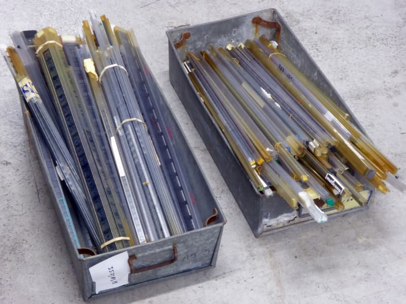 Plastic tubes of integrated circuit sockets in galvanised steel trays