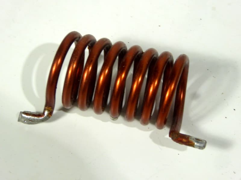 Small thickly wound copper wire coil