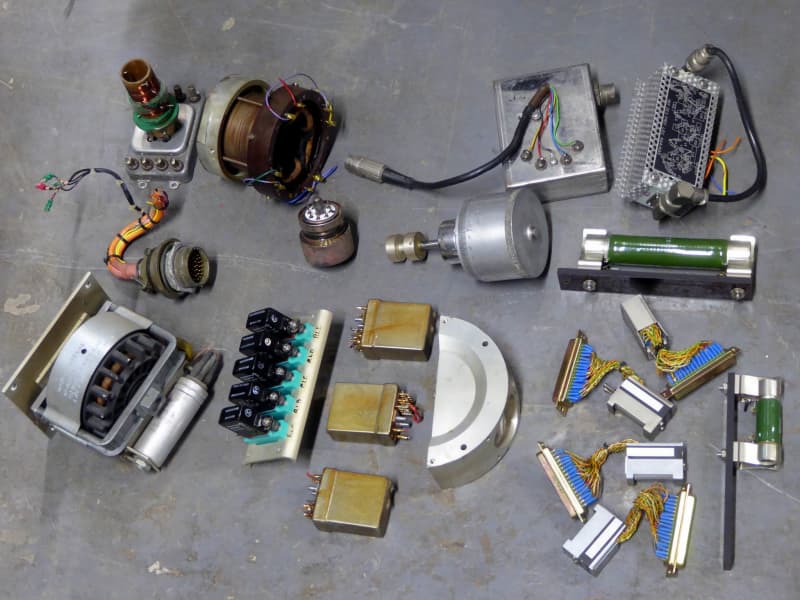 Assorted electronic components, motors, relays, valve, power resistors, optics, connectors, coil