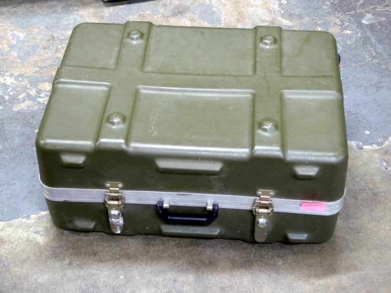 Ruggedised, ribbed khaki plastic flight case with corner wheels