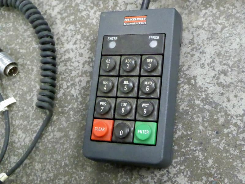 Chunky black keypads with particularly long curly cable