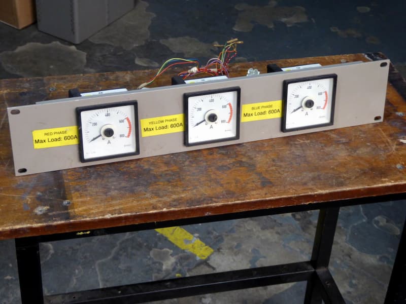 Triple electrical 270° panel meters with movable pointers & part red scales