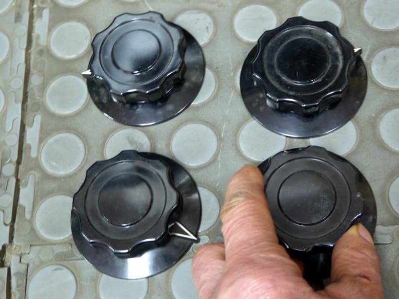 Medium sized black fluted bakelite knobs with skirt & pointer