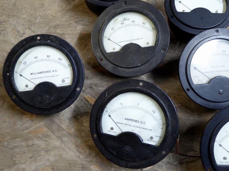 Period round black bakelite electrical panel meters