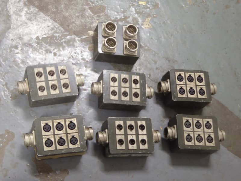 Khaki coloured military connection boxes with bold connectors