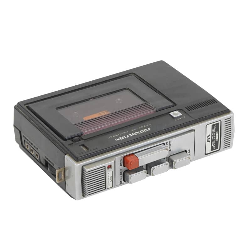 Portable 1970s cassette tape recorder/player in silver & black