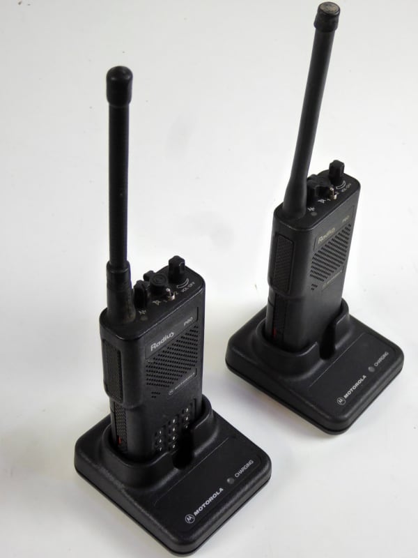 Motorola P60 1990s black Walkie-talkies with optional charger bases