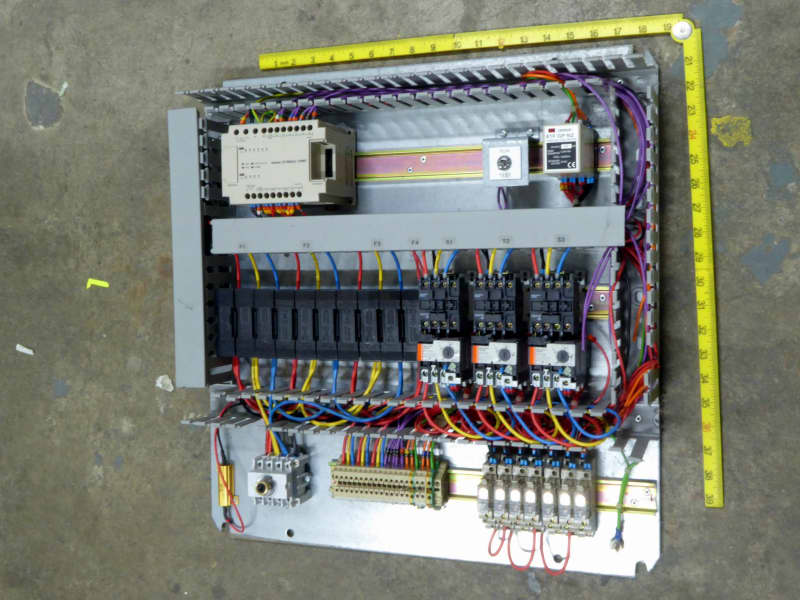 Electrical control box innards with wiring loom, circuit breakers, timers, PLC etc