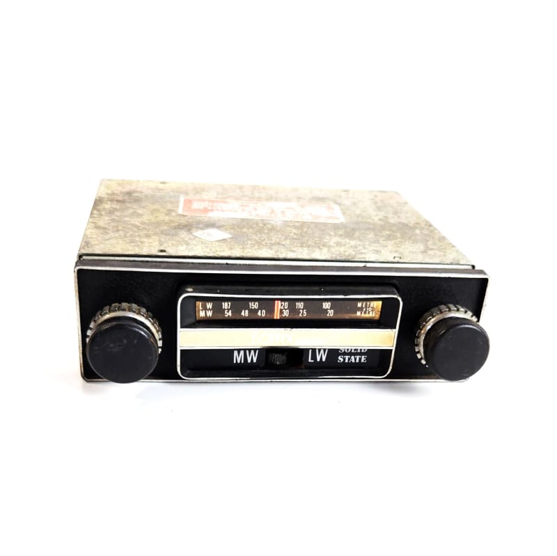 Practical 1970s period broadcast car radio with illuminated tuning scale