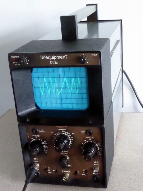 Practical upright Telequipment oscilloscope in black & silver