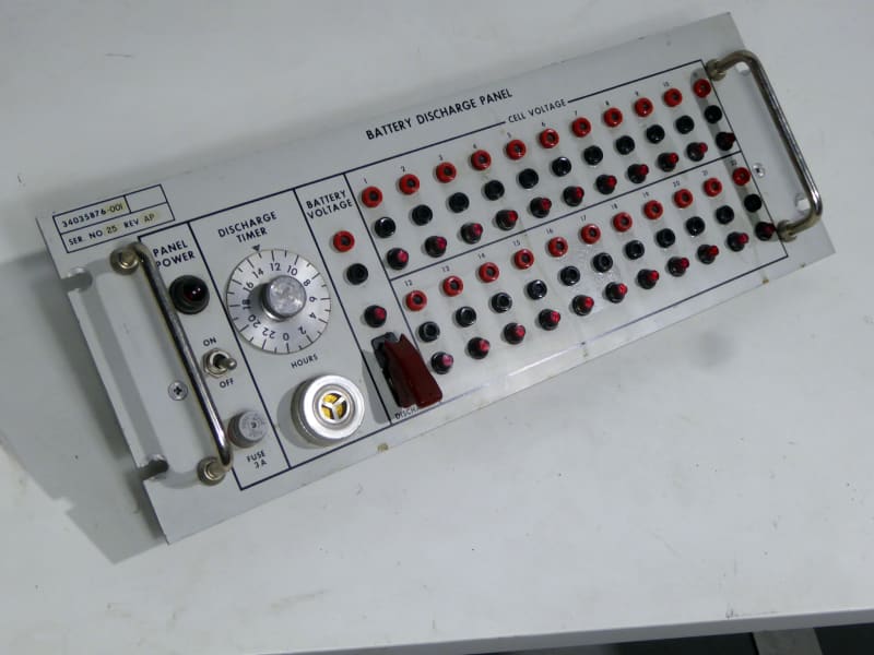 Rack mounting battery discharge control panel with multiple red black sockets, LEDs, timer dial