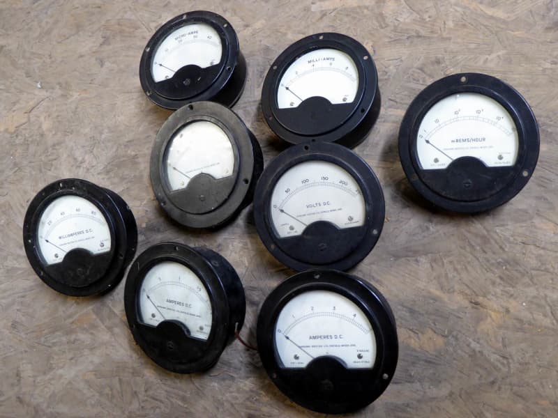 Period round black bakelite electrical panel meters