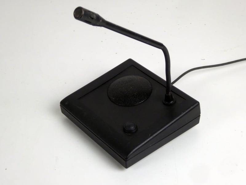 Black desk console microphone with bendy/goose neck, speaker grill & Press To Talk button