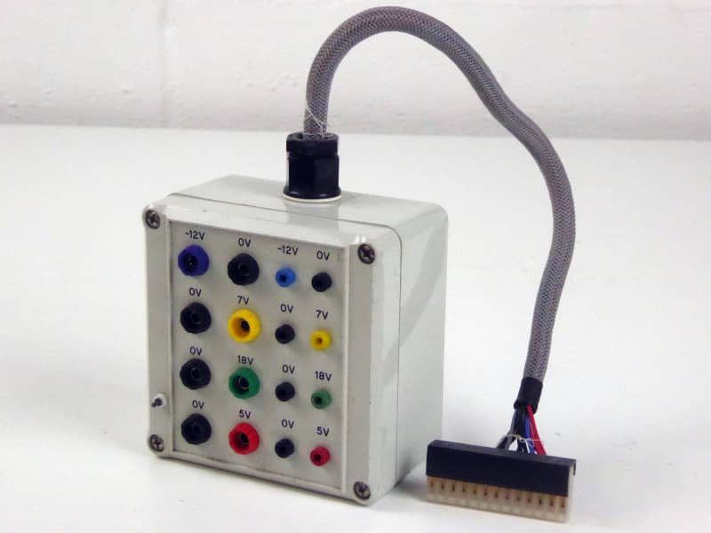 Small white box with colourful terminal sockets