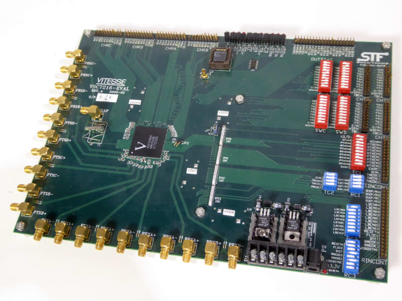 Printed Circuit Board with coloured banks of switches, multiple gold SMA connectors