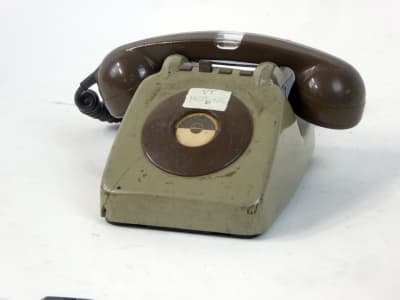 Specialised dial telephone with light built into handset