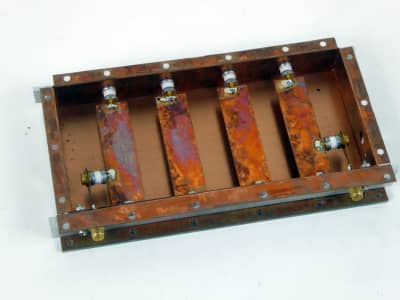 Iridescent copper strips in flanged copper box