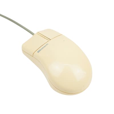 Beige 1990s Microsoft mouse 