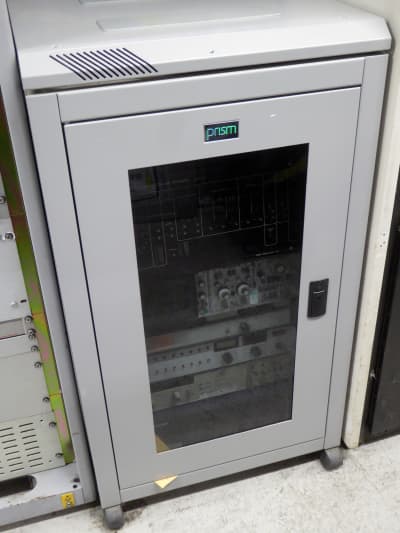 Low, wheeled server rack in light grey with smoked glass door