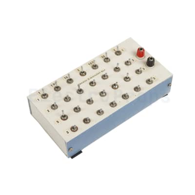 Multiple small silver switches, laboratory Resistor Substitution Box