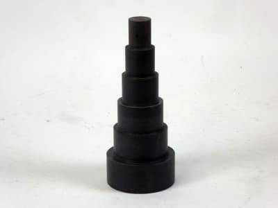 Machined grey stepped tower of Hanoi shape