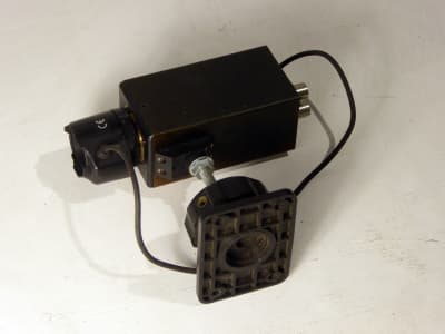 Small black internal CCTV camera on wall bracket