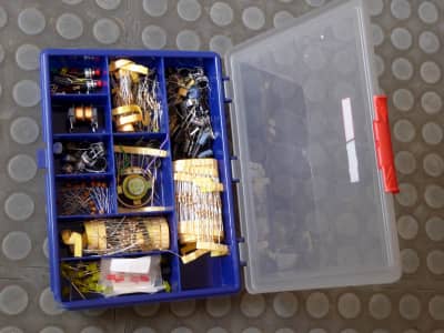 Selection of electronics service components in transparent topped compartmentalised case