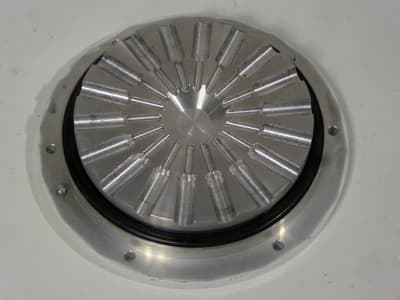 Aluminium cover disk with engraved starburst pattern