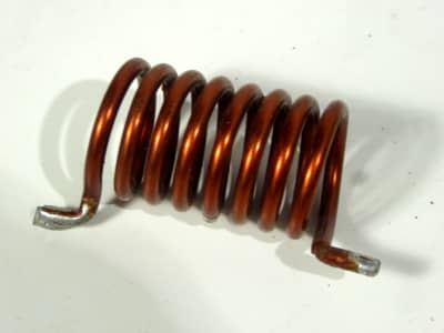 Small thickly wound copper wire coil