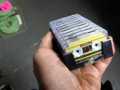 Block of tiny dictaphone cassette tapes in plastic holder