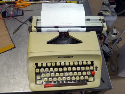Practical 1980s-1990s manual typewriter with red/black ribbon