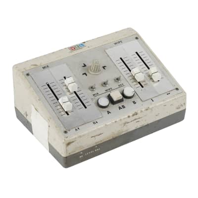 Small sloping front Video Editing Mixer console with faders, buttons