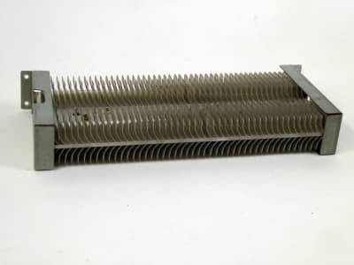 Large electronics cooler with curved shaped fins