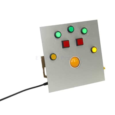 Practical square silver panel with yellow trackball & large illuminated coloured buttons