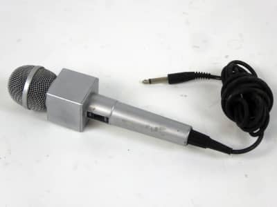 News reporter's hand-held microphone with logo label surround