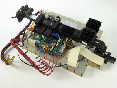 Complex modern microwave transmitter electronics, coloured wiring, black wave guide